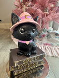 Halloween pink kitty on spell book