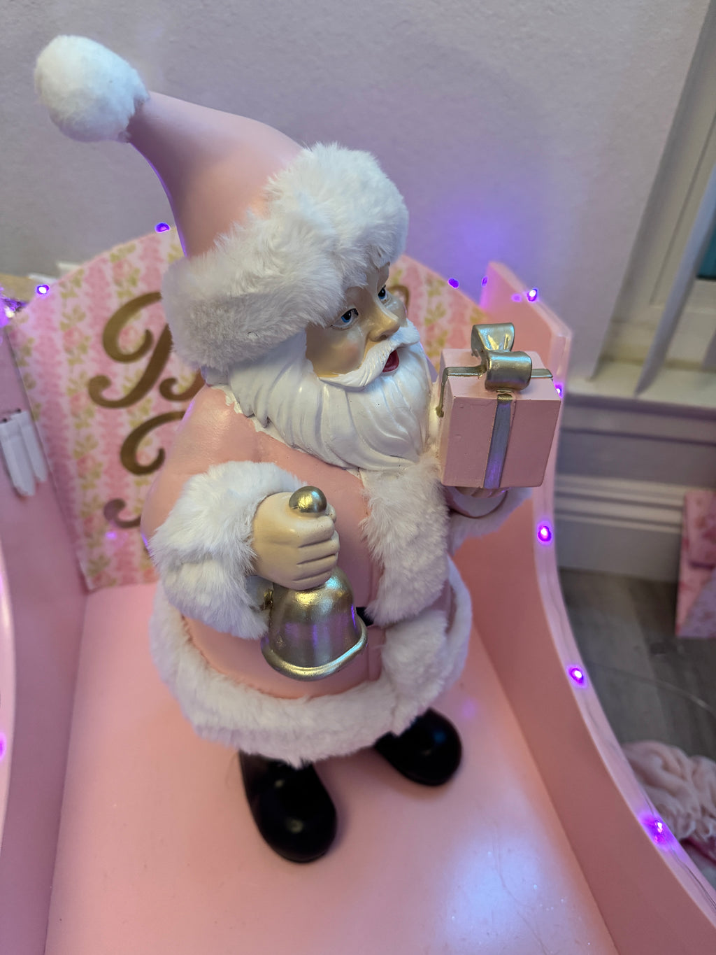 Pink Santa with gifts and bell