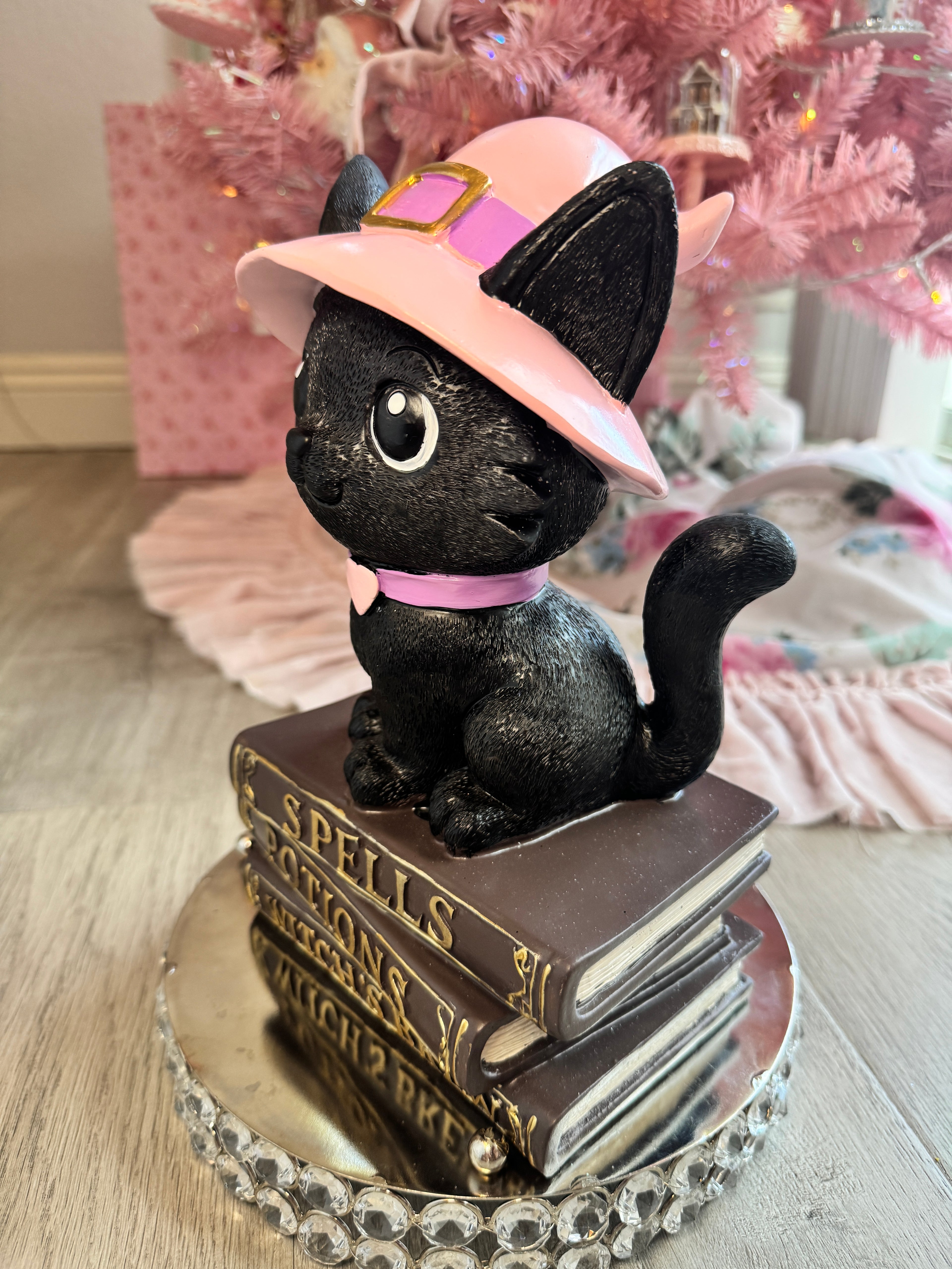 Halloween pink kitty on spell book