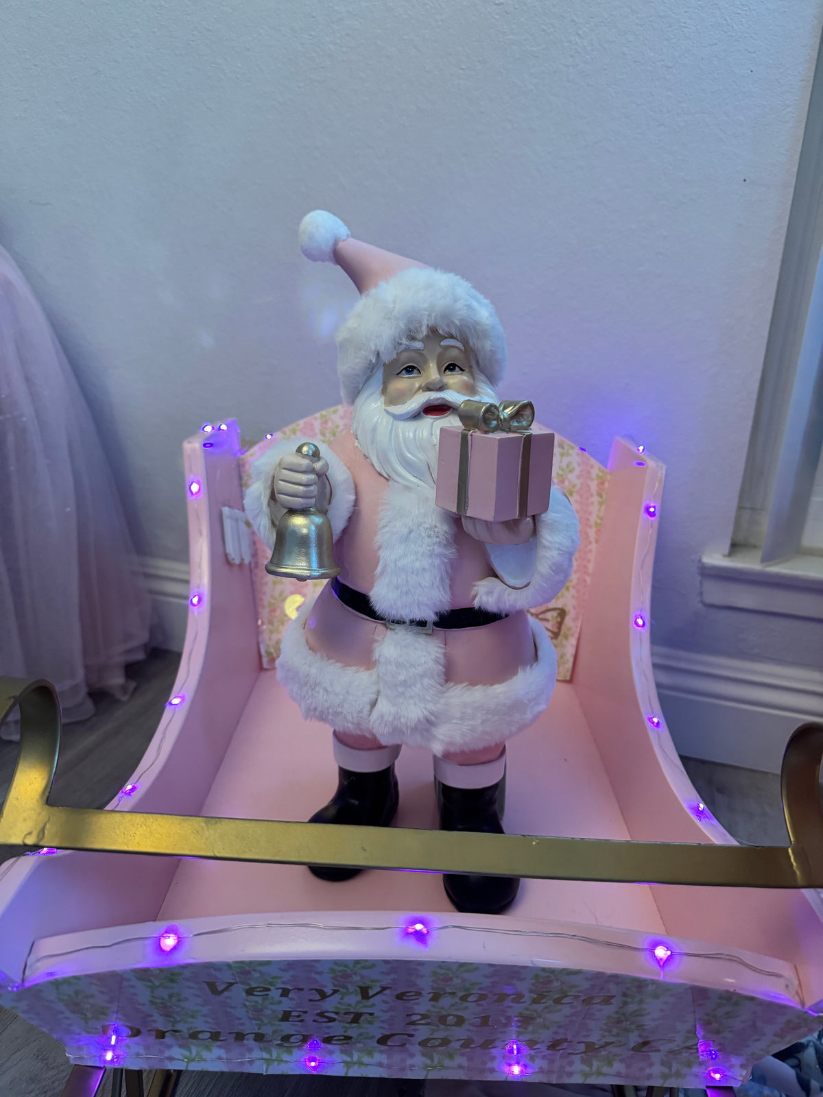 Pink Santa with gifts and bell