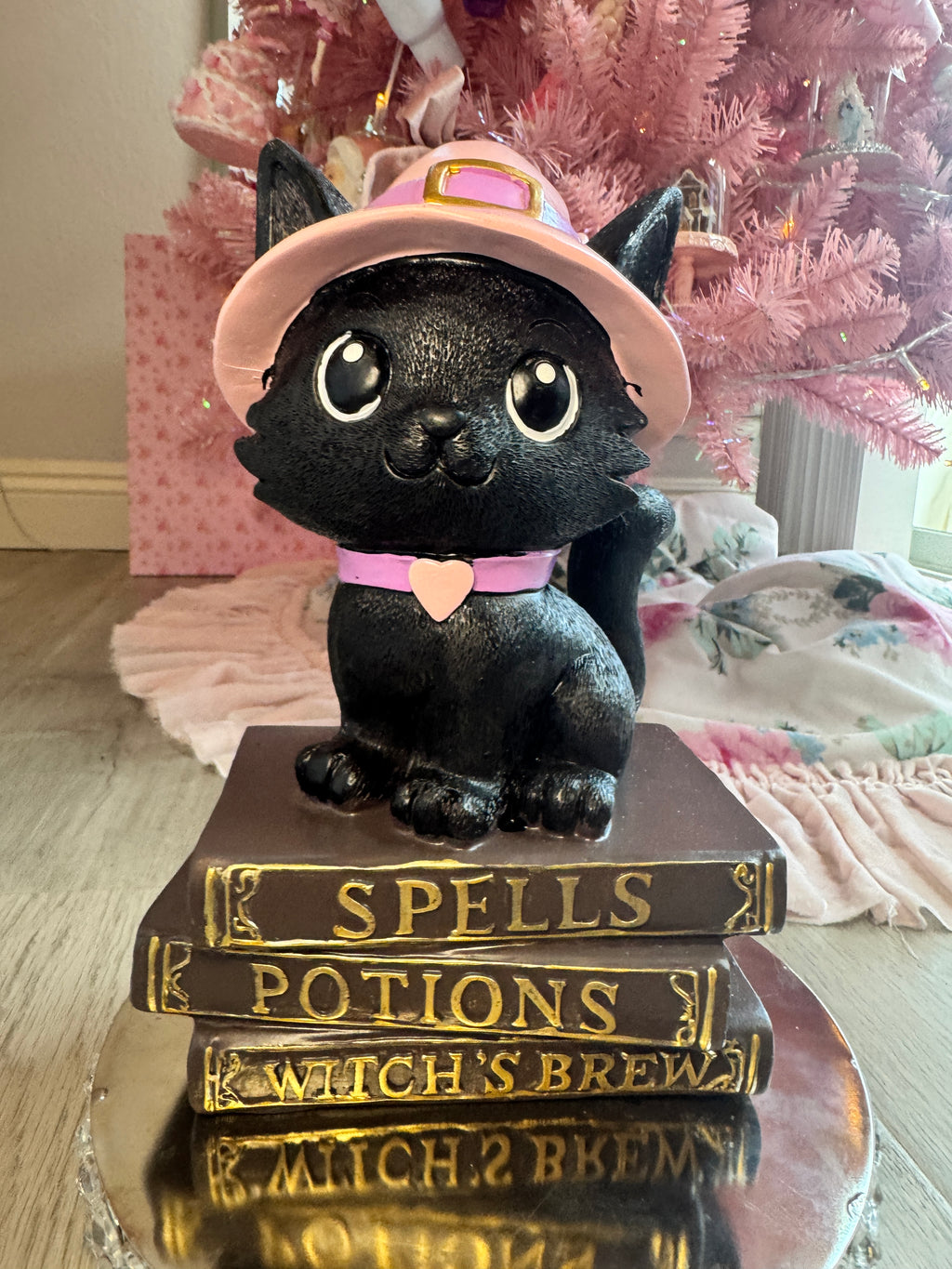 Halloween pink kitty on spell book