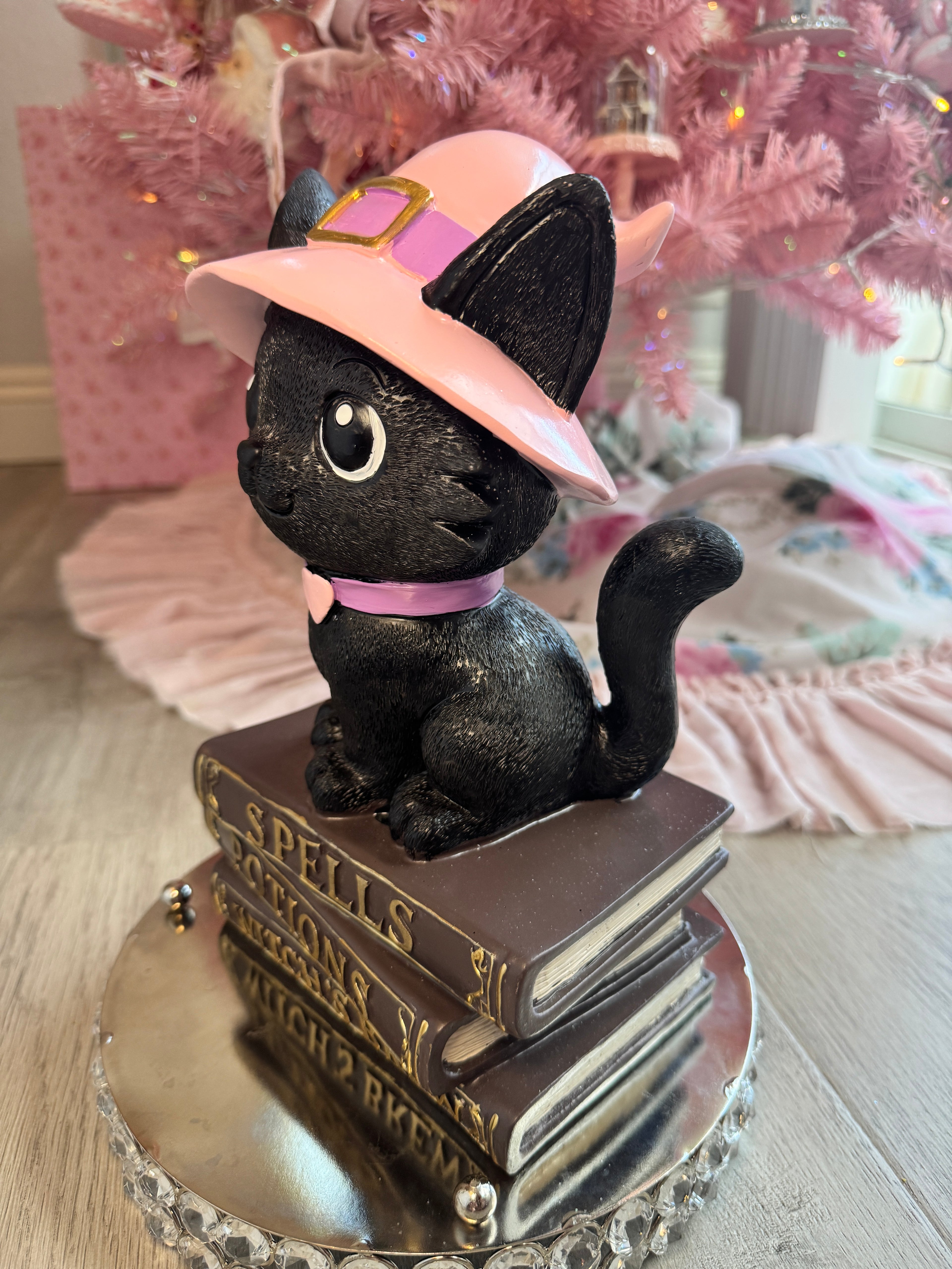 Halloween pink kitty on spell book