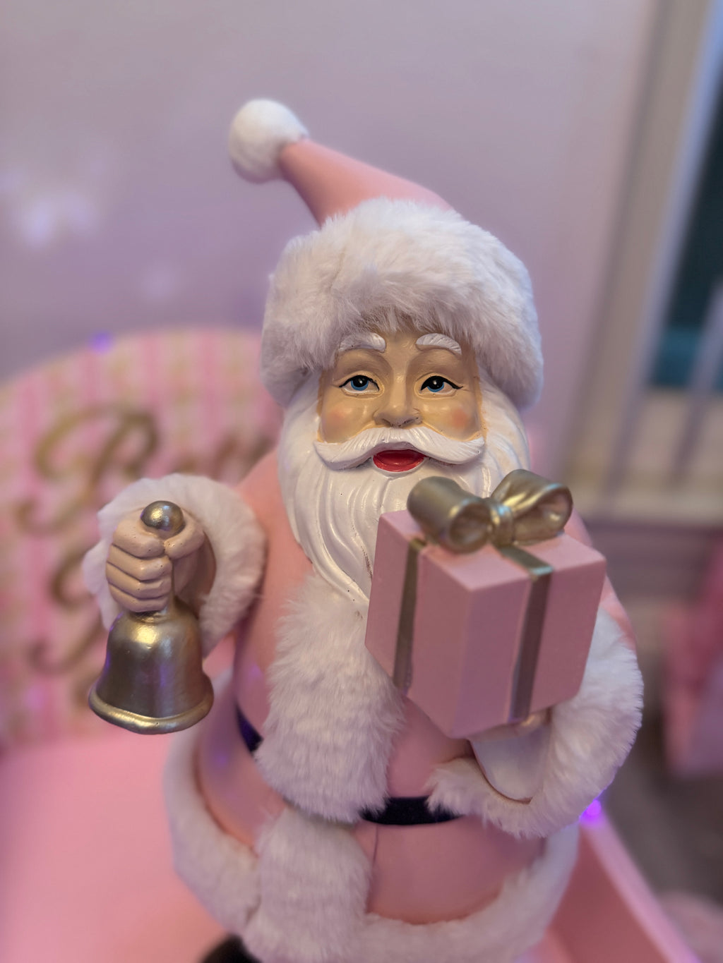 Pink Santa with gifts and bell