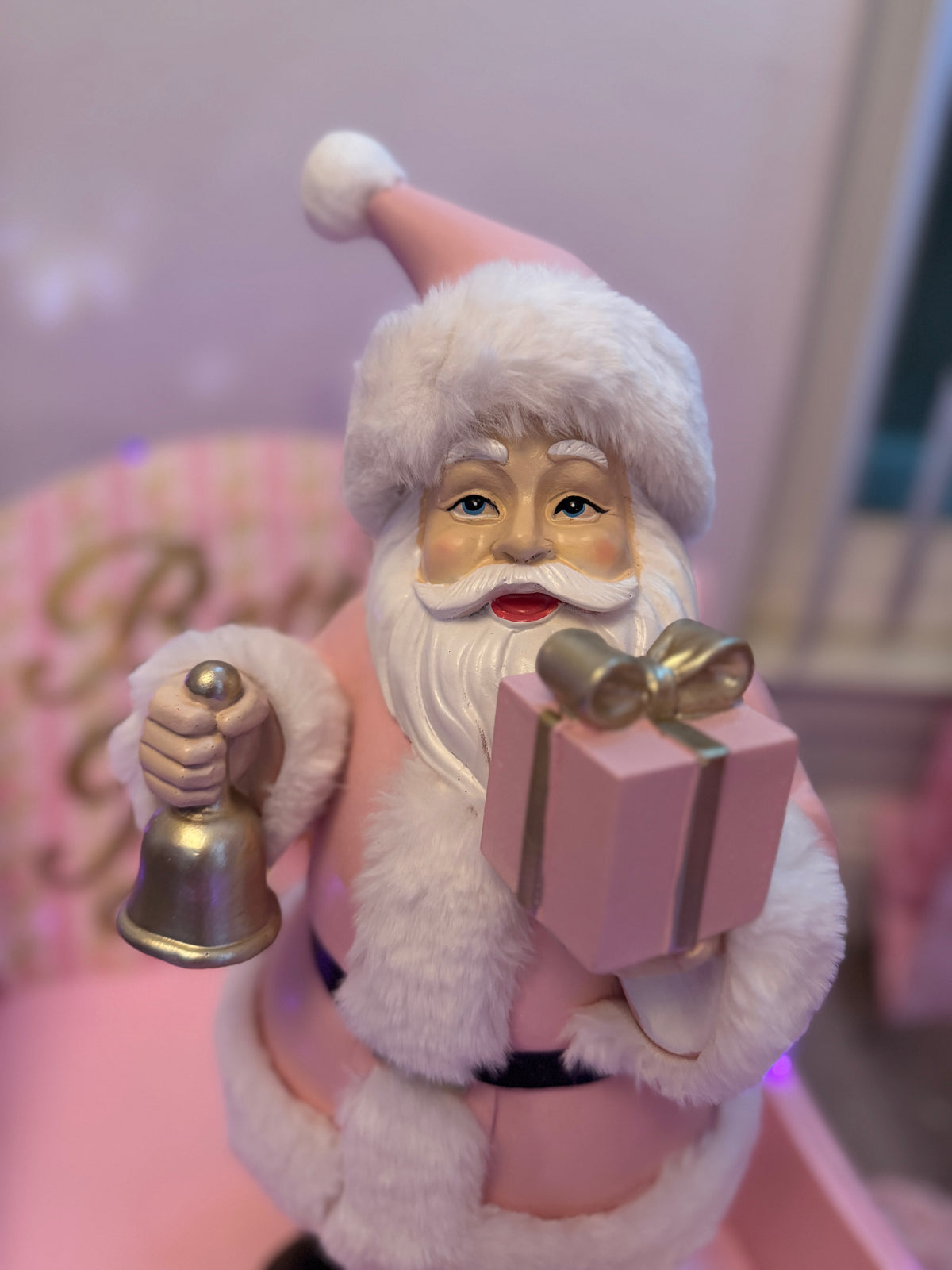 Pink Santa with gifts and bell