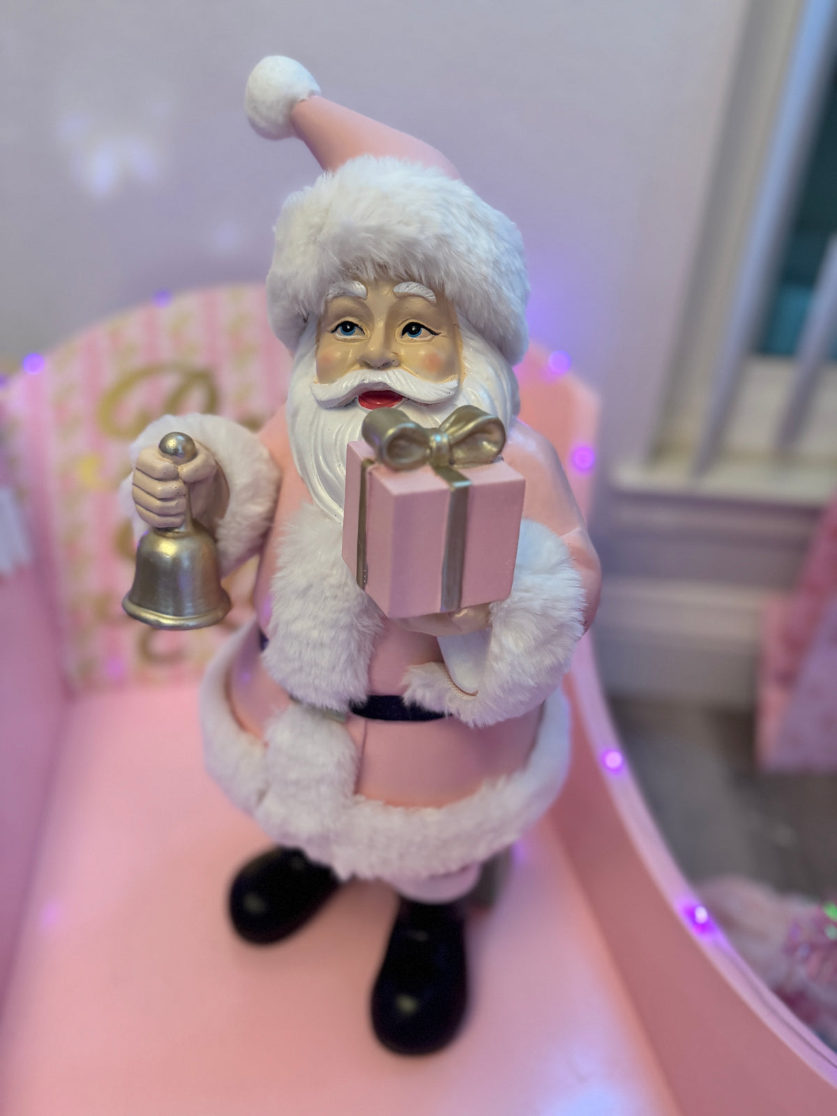 Pink Santa with gifts and bell