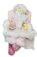 Pink Santa with on recliner figurine
