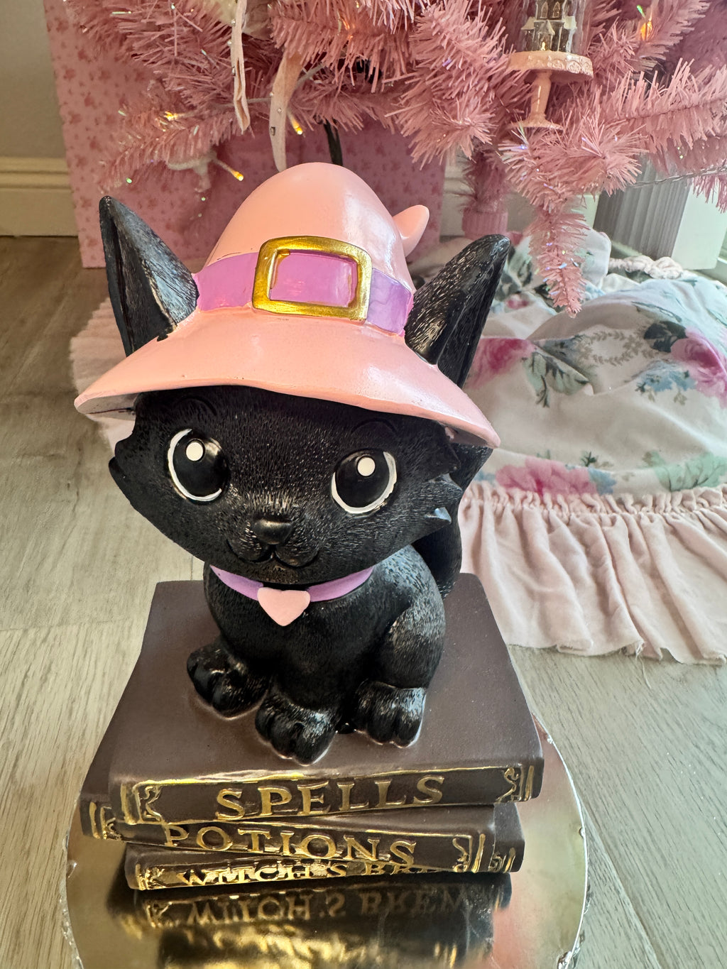 Halloween pink kitty on spell book
