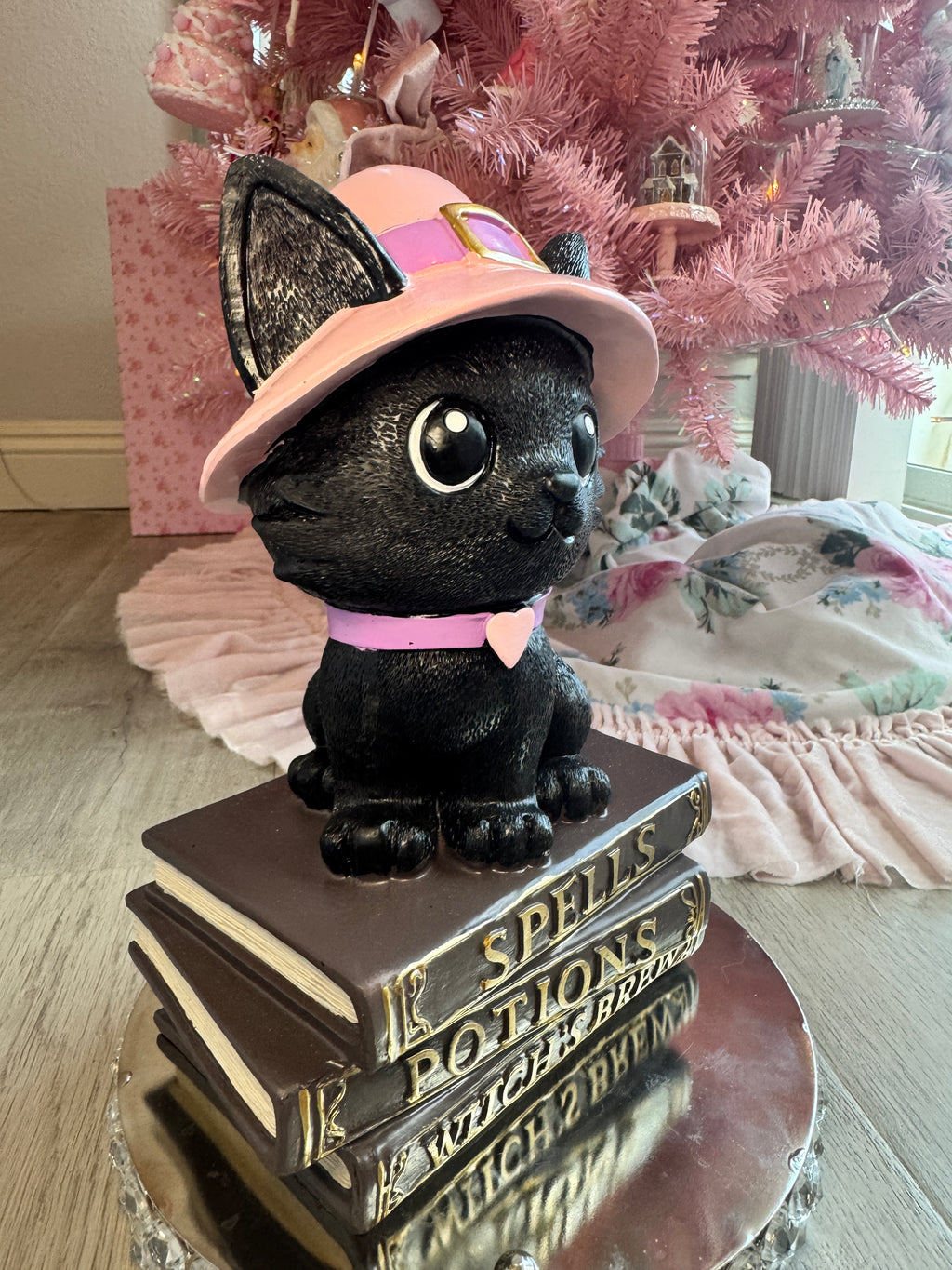 Halloween pink kitty on spell book