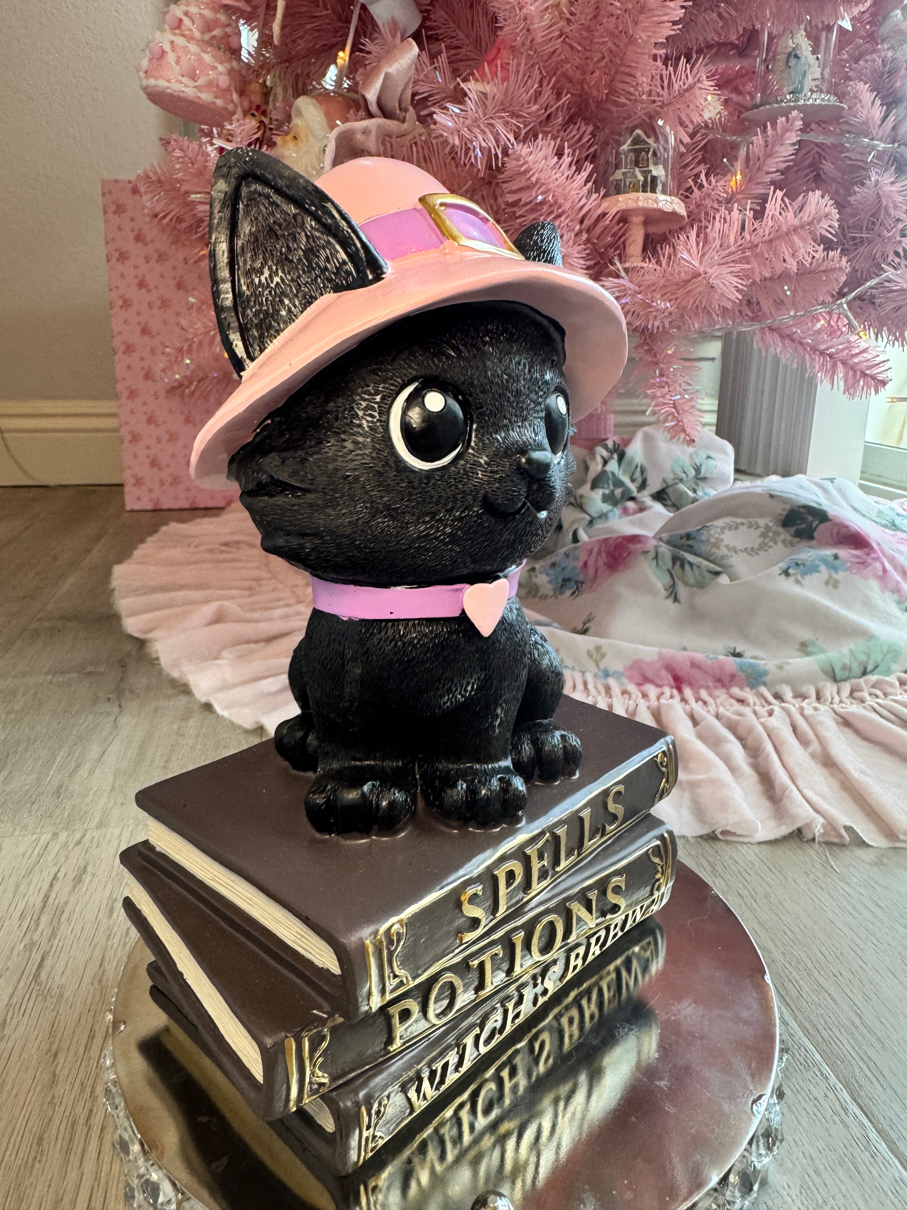 Halloween pink kitty on spell book