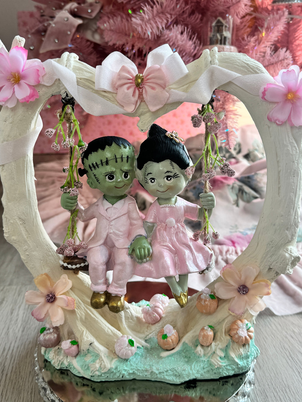 Frankenstein and Bride on swing