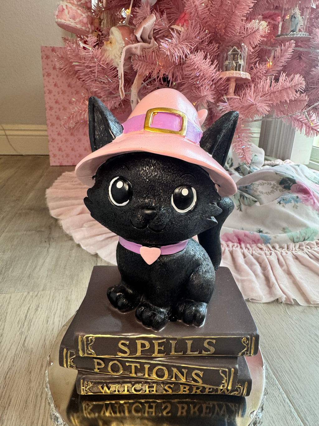 Halloween pink kitty on spell book