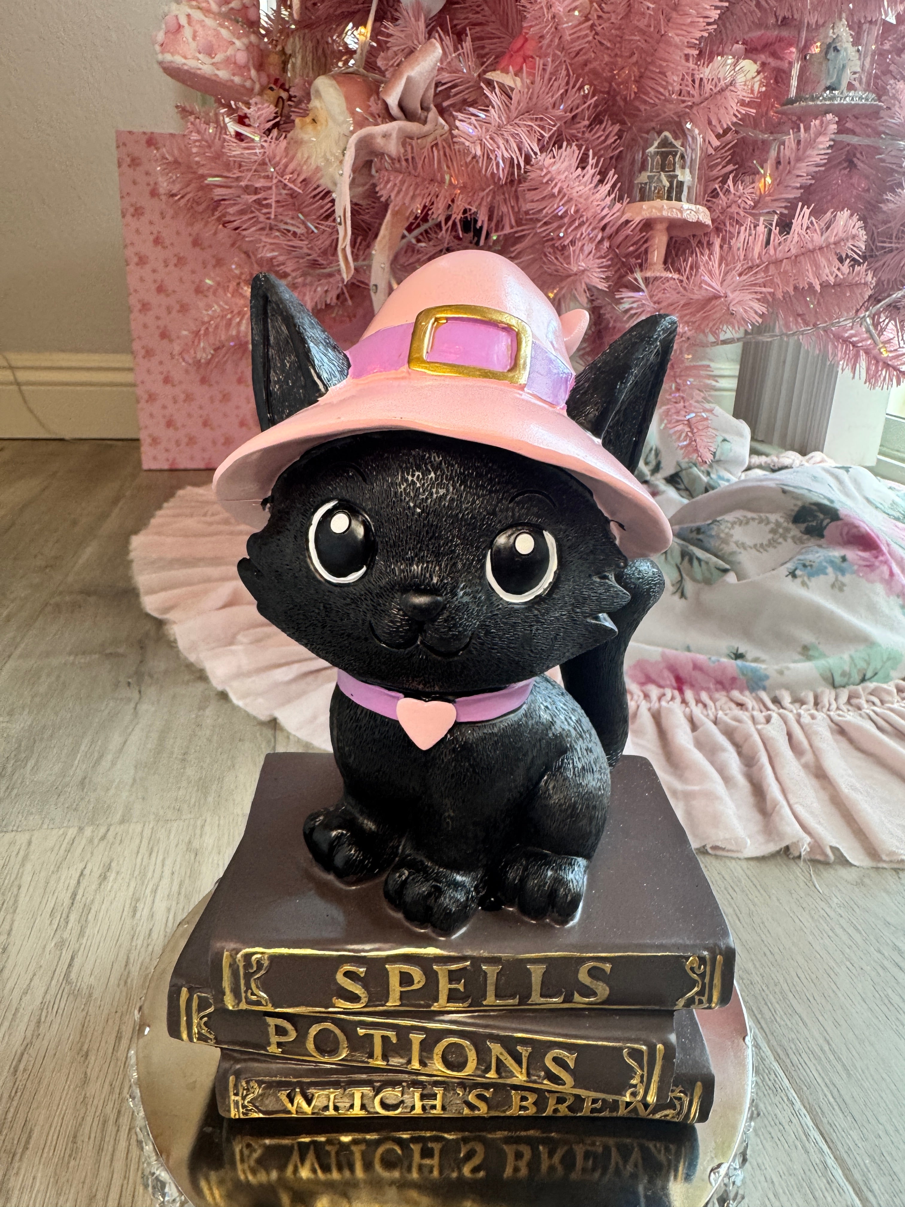 Halloween pink kitty on spell book