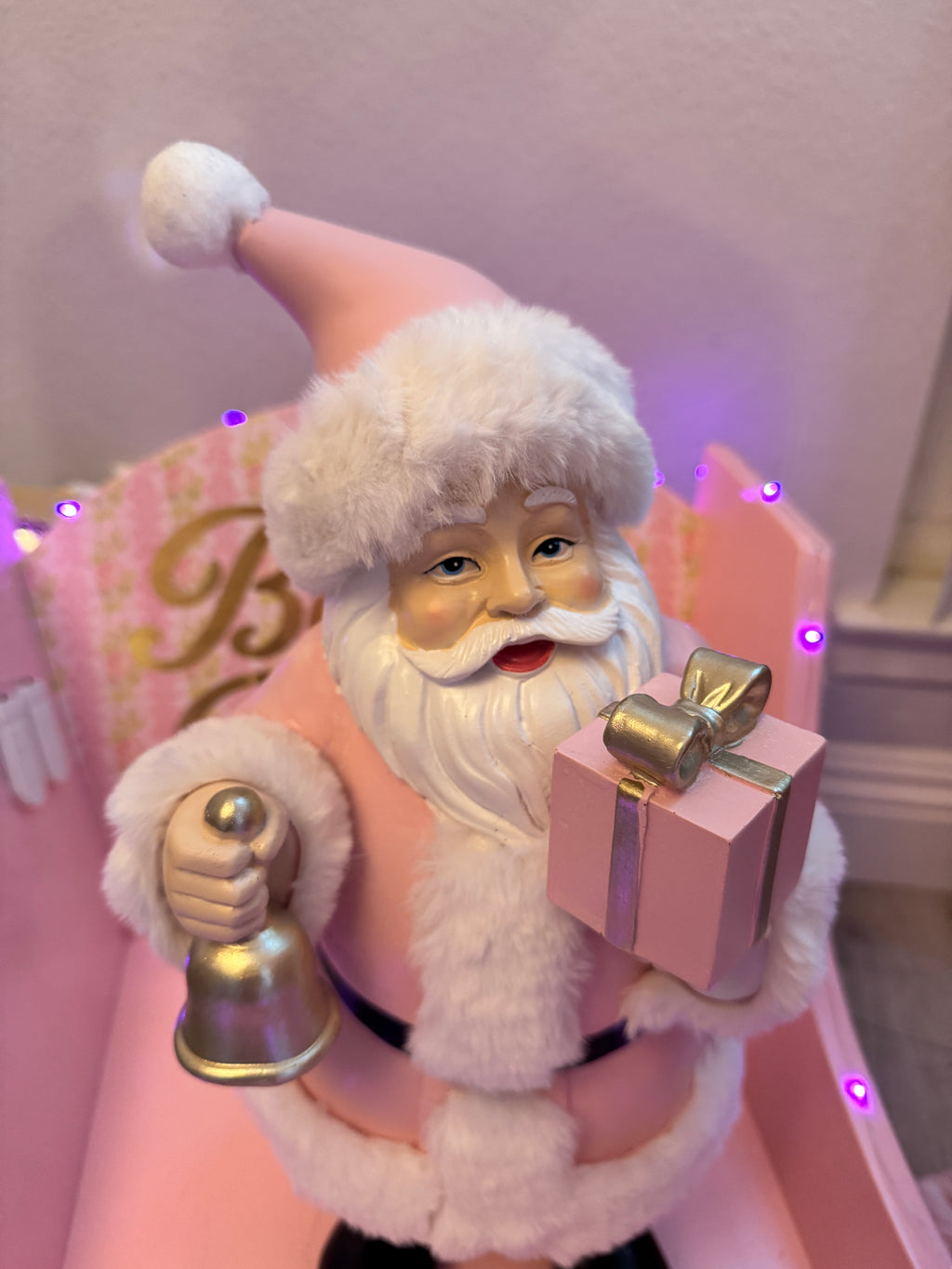 Pink Santa with gifts and bell