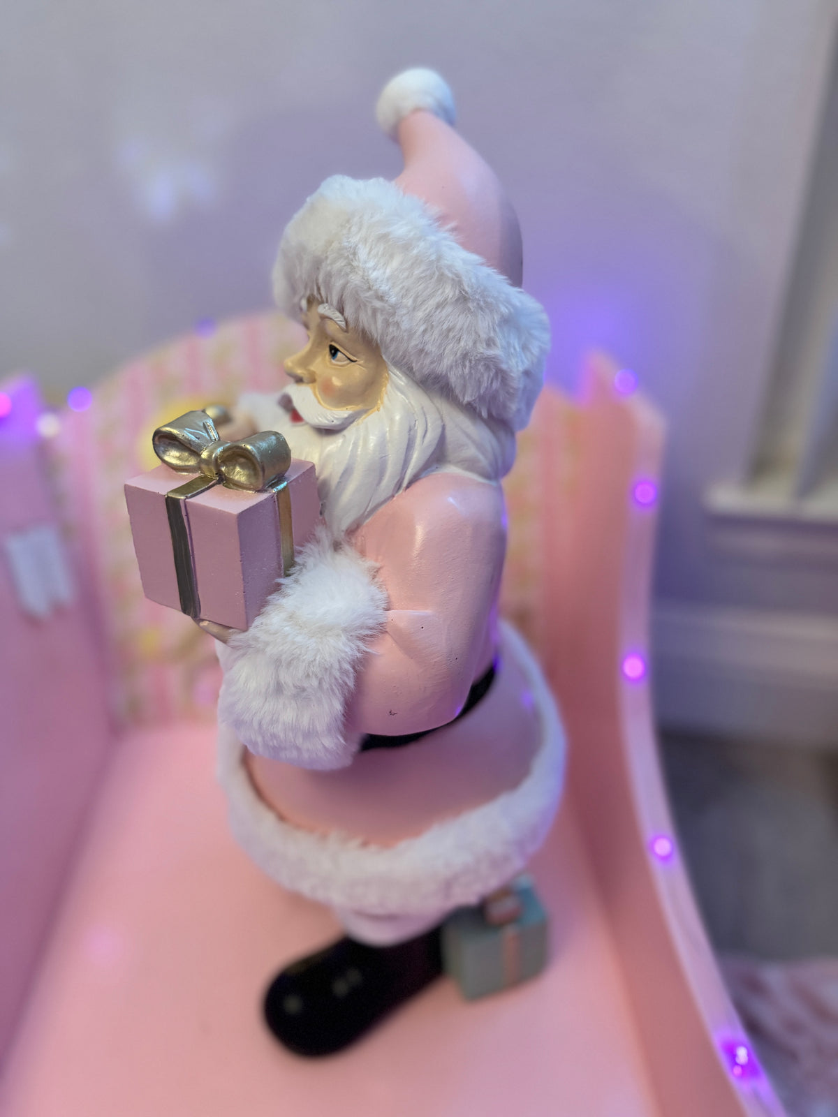 Pink Santa with gifts and bell