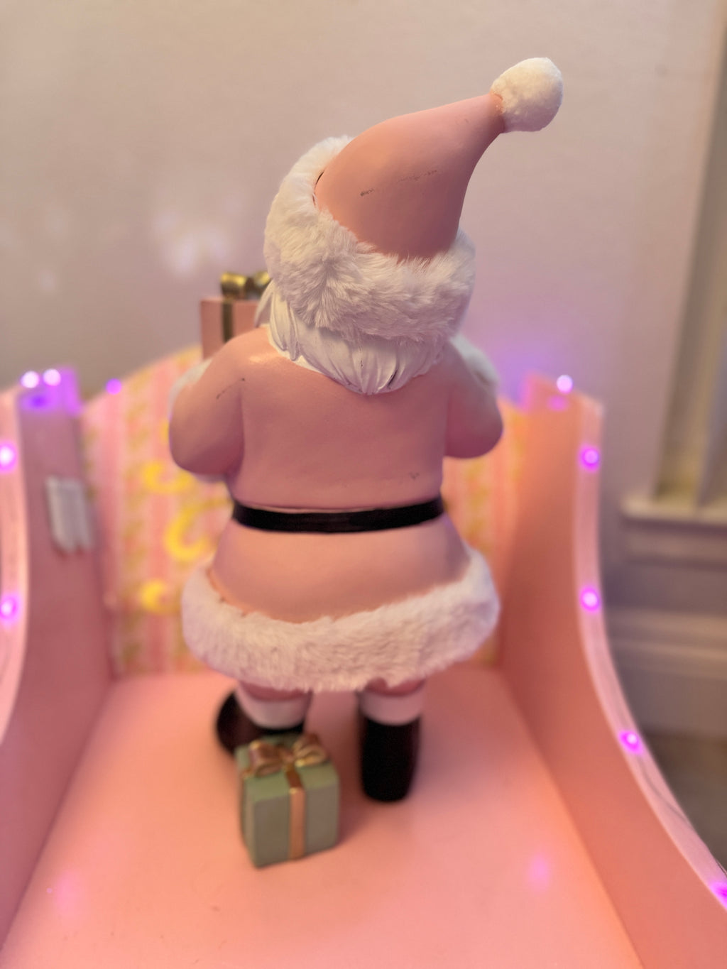 Pink Santa with gifts and bell