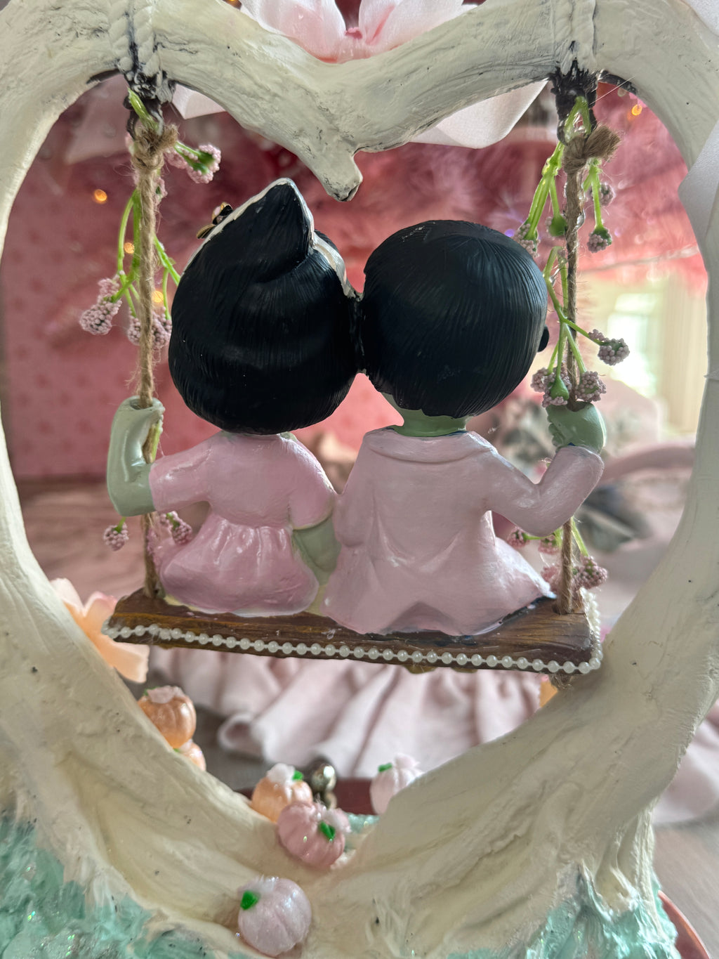 Frankenstein and Bride on swing