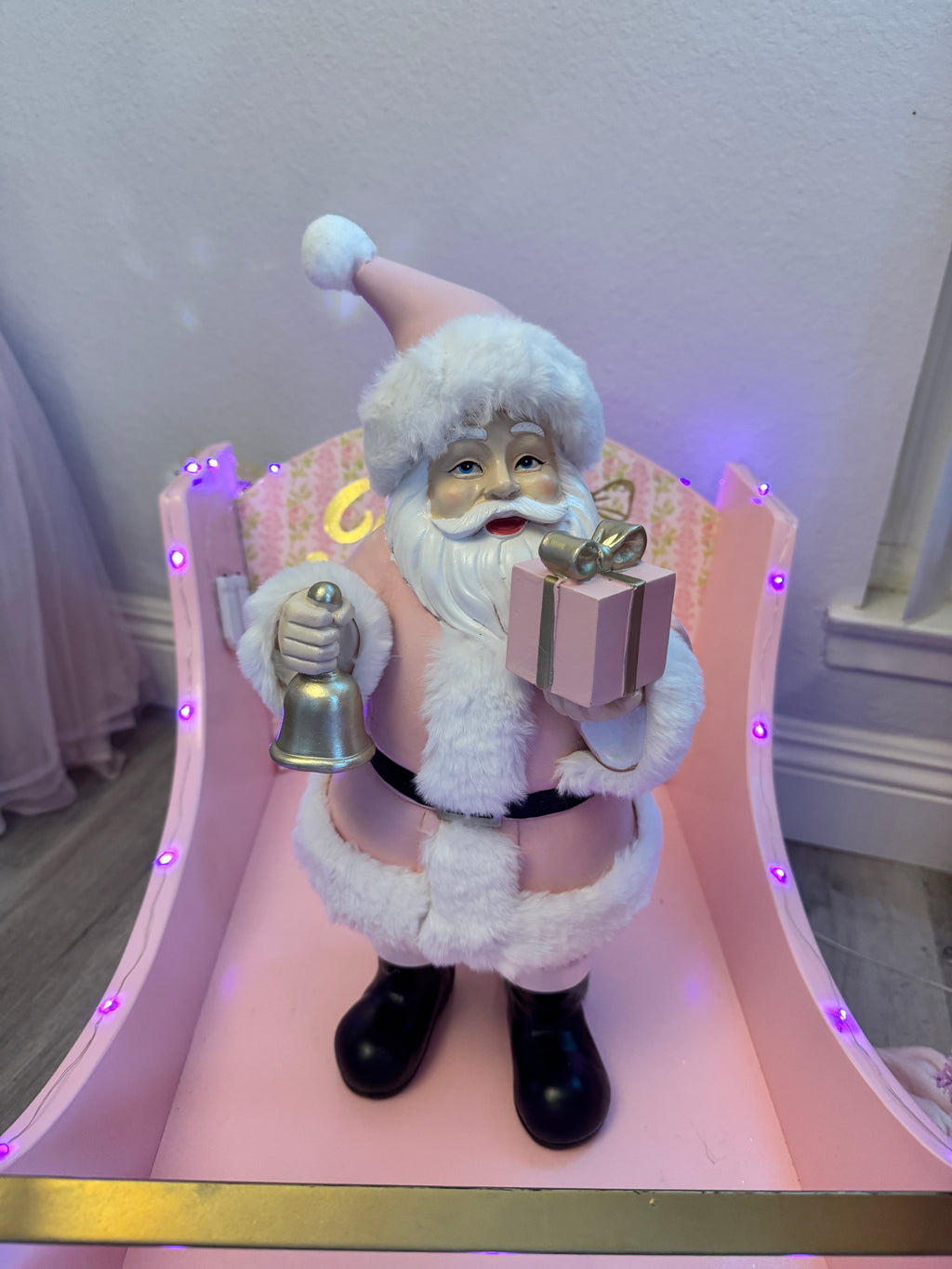Pink Santa with gifts and bell