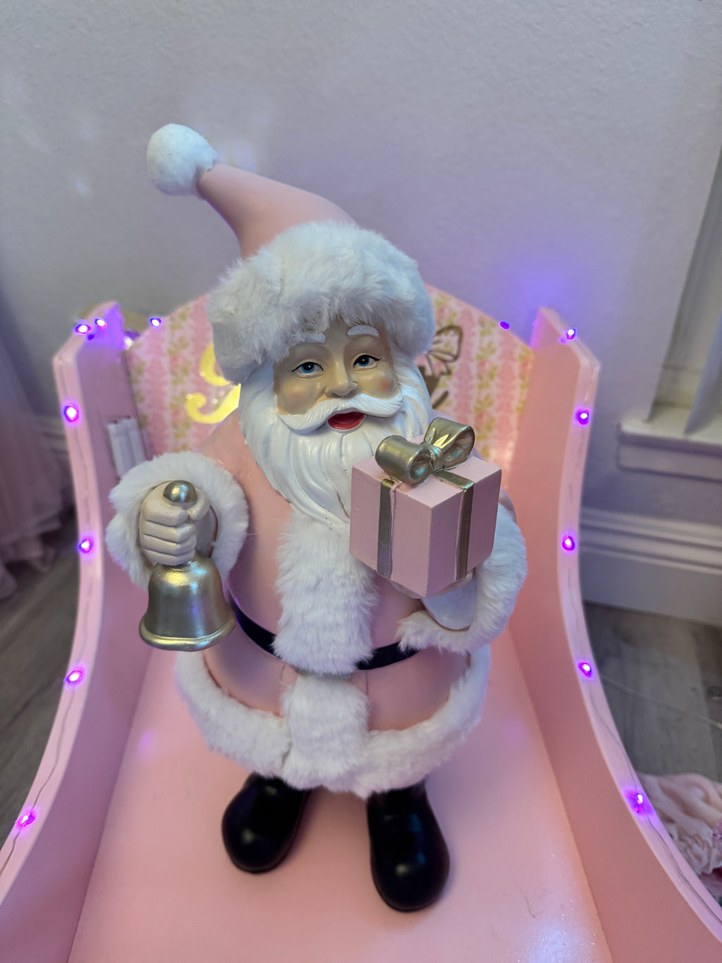 Pink Santa with gifts and bell