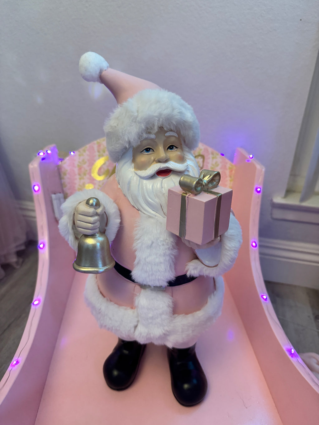Pink Santa with gifts and bell