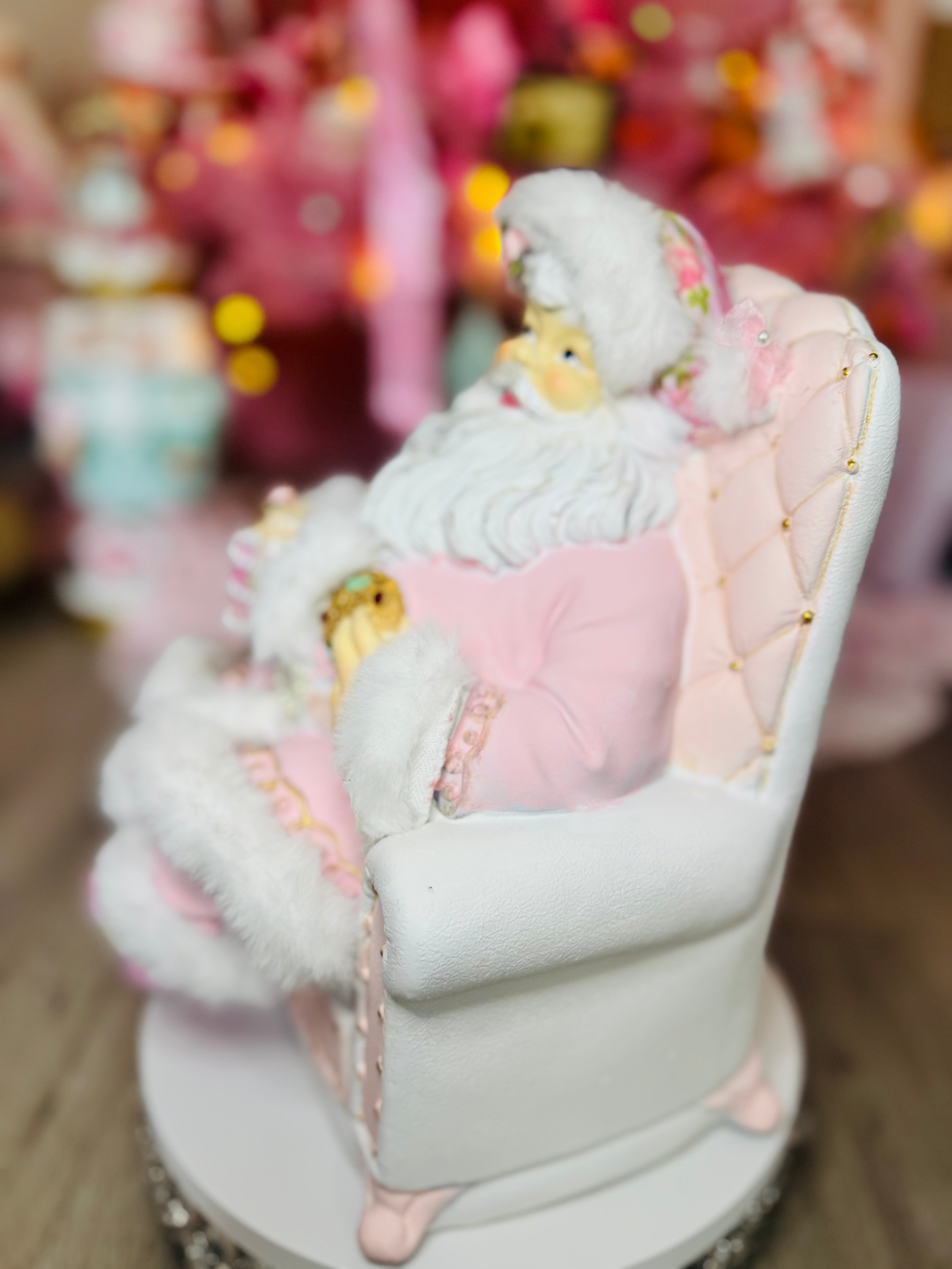 Pink Santa with on recliner figurine
