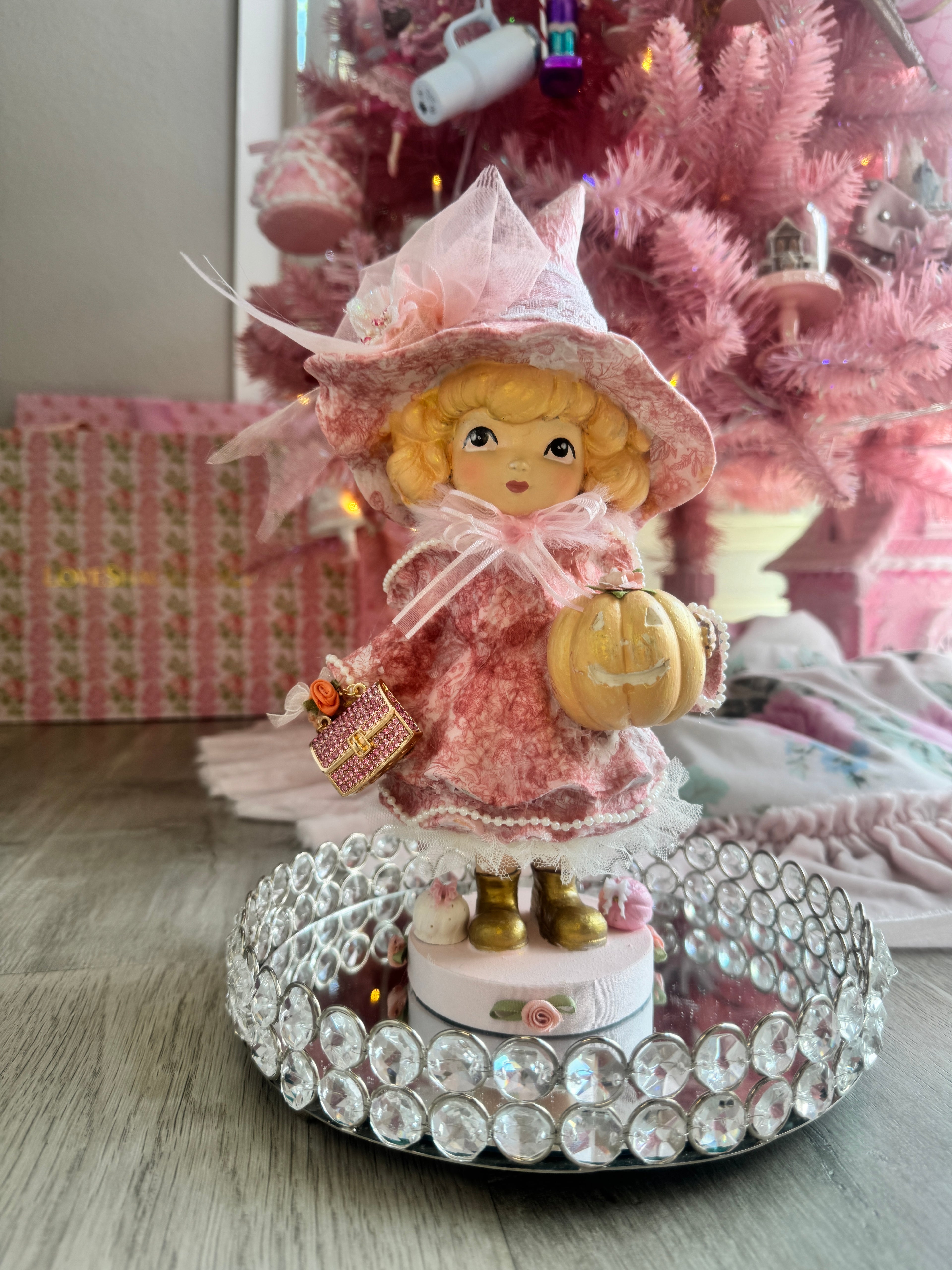 Pink Girl holding Purse and Pumpkin Figurine