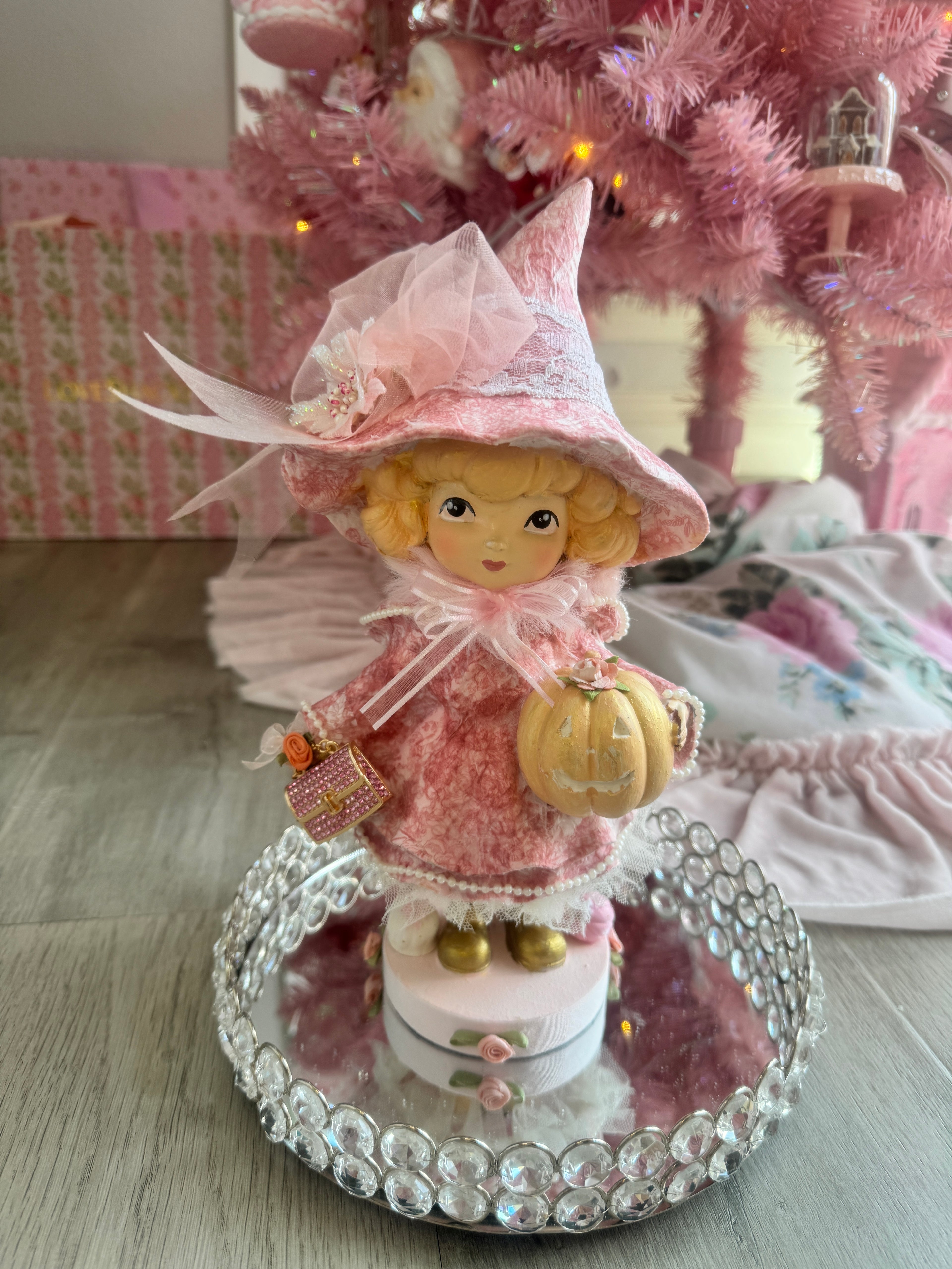 Pink Girl holding Purse and Pumpkin Figurine