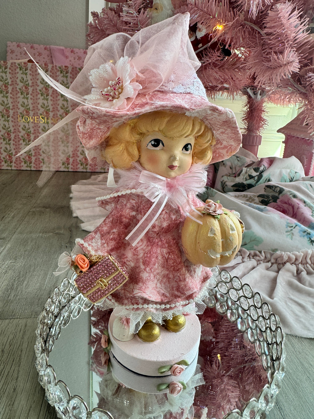 Pink Girl holding Purse and Pumpkin Figurine