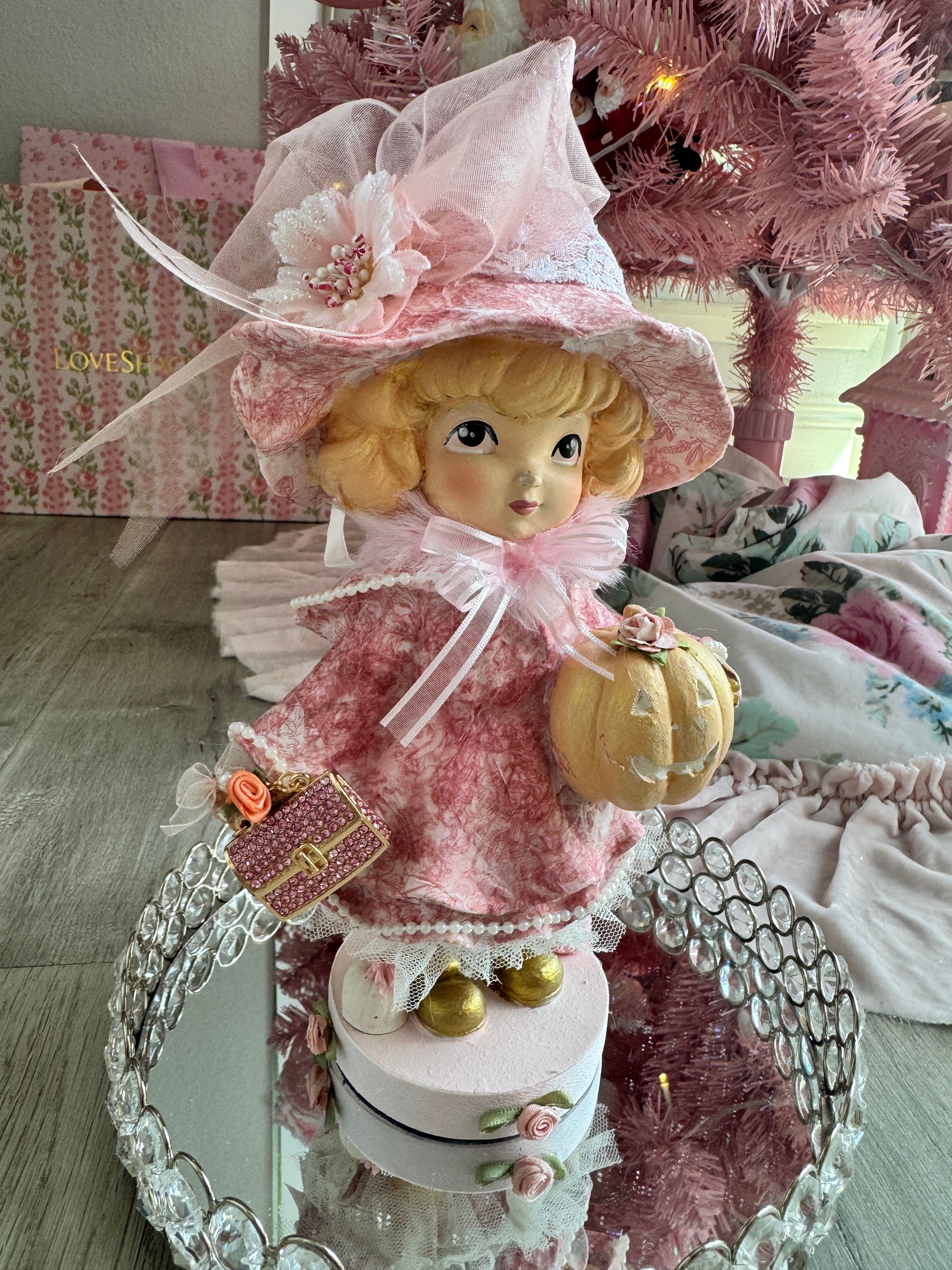 Pink Girl holding Purse and Pumpkin Figurine