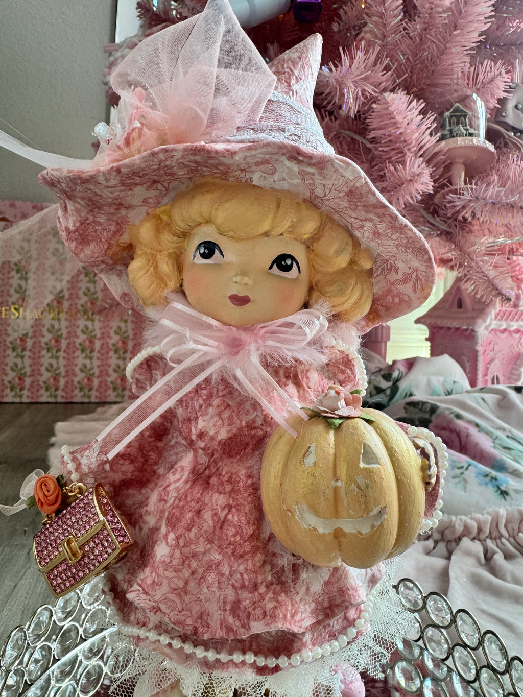 Pink Girl holding Purse and Pumpkin Figurine