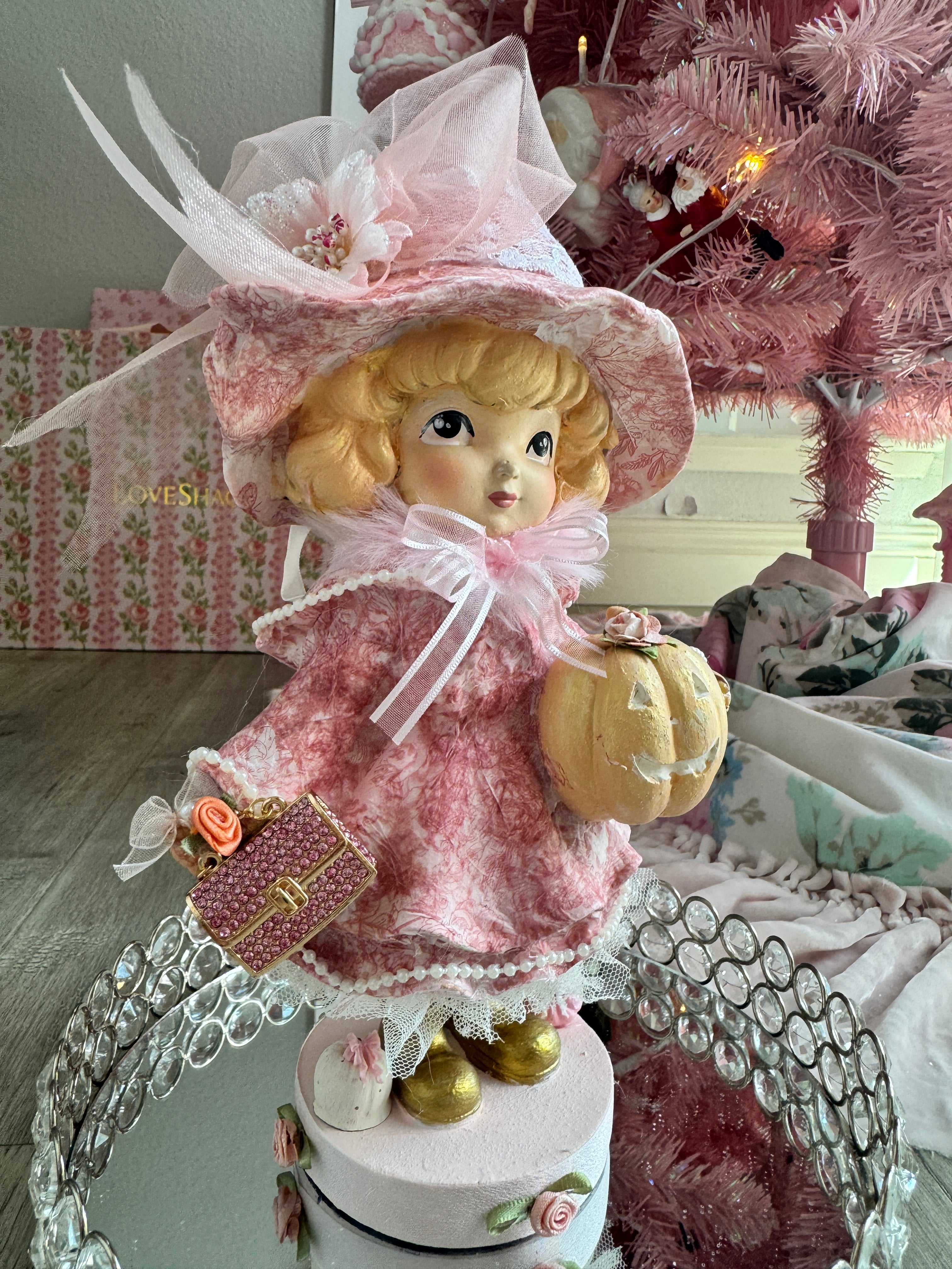 Pink Girl holding Purse and Pumpkin Figurine