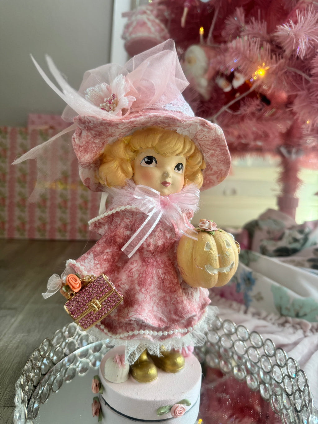 Pink Girl holding Purse and Pumpkin Figurine